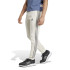 Pantalones adidas Essentials Fleece Tapered Cuff 3 Bandas Hombre Beige